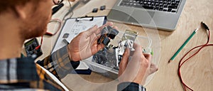 Partial IT engineer choosing microchip during work