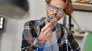 Partial male technician or engineer hold microchip