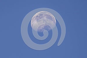 Partial Moon Over A Blue Sky