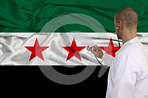 Partial photograph of the doctor in uniform against the background of the Syrian opposition national flag on delicate shiny silk,