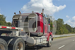 Partial side view of truck cab and flatbed