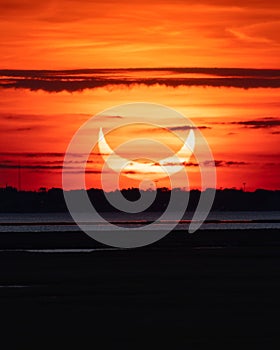 Partial solar eclipse as the moon passes in front of the sun.