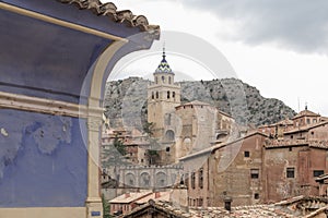 Partial view of AlbarracÃÂ­n, in the foreground part of a characteristic blue facade, in the background the cathedral. Teruel, Arag photo