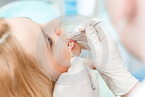 Partial view of blonde woman at dental check up