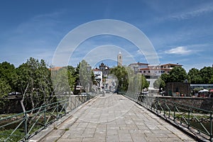 The pedestrian bridge and the city photo