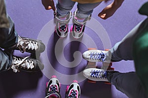 partial view of family in roller skates standing