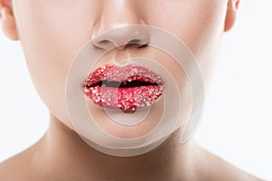 partial view of girl with sweet sugar on lips