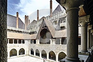 Partial view of the main courtyard of the palace of the Dukes of Braganza from the arcaded gallery on the first floor and with tou