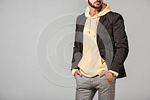 partial view of male model in fashionable autumn outfit