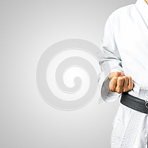 Partial view of a man in karate uniform