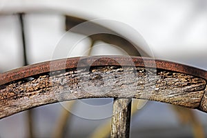 Partial view of an old  wooden wagon wheel