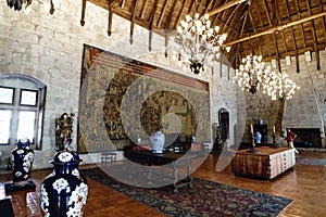Partial view of one of the halls of the palace of the Dukes of Braganza with large vases of Chinese porcelain, polychrome tapestry