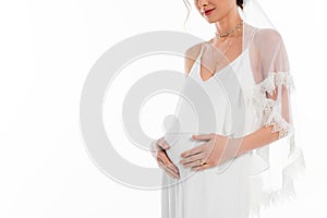 partial view of pregnant fiancee touching
