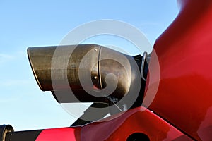 A Partial view of a red helicopter turbine