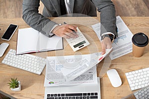 view of trader working with infographics