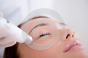 partial view of woman getting facial treatment