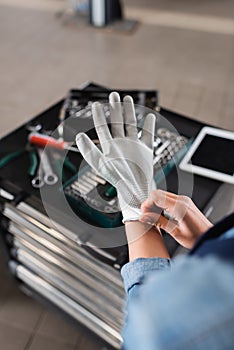 partial view of young mechanic wearing