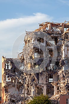 Partially demolished building in afternoon sun