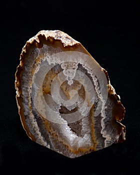 Partially polished multicolor agate geode with crystaline druzy center photo