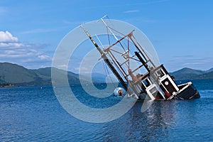 Partially submerged fishing vessel in Loch Linnie