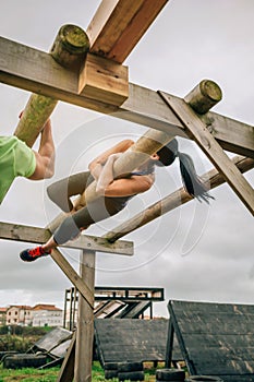 Participant in a obstacle course doing weaver