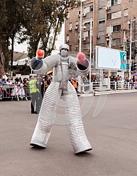 Participants at ÃÂarnival dressed in robots are walking along st