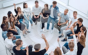 Participants ask questions during the business seminar