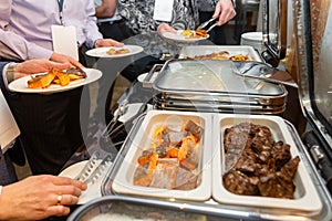 The participants of the business seminar choose food