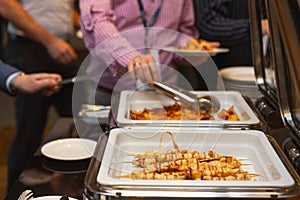 The participants of the business seminar choose food