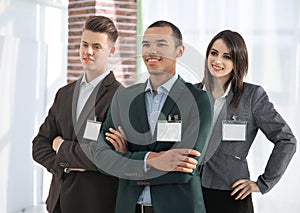 Participants of the conference with personal letterhead badges.