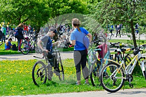 Participants of mass spring bike ride, dedicated to opening of cycling season 2019, after end of event in recreation area, Gomel