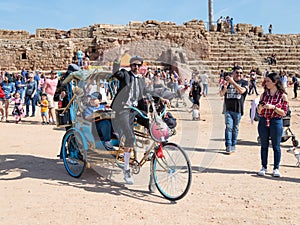 A participants of the Purim festival dressed in fabulous costumes, show performance in Caesarea, Israel