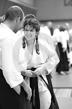 The participants of the training in the special clothing of the hakama aikido