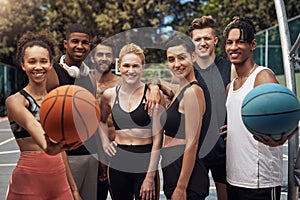 Participating in youth basketball is a fun way to build friendships. Portrait of a group of sporty young people standing