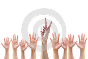 Participation, leadership, volunteer concept with V- Victory sign on leader`s two fingers among blur hands crowd isolated on white