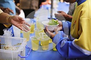 Participation in sharing food for the poor : The Concept of Love : The beggar is waiting for food from charity aid : Charity food