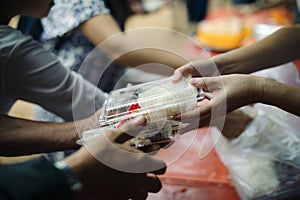 Participation in sharing food for the poor : The Concept of Love : The beggar is waiting for food from charity aid : Charity food