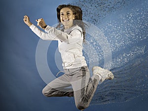 Particle decay effect. Athletic woman in sportswear. Training day