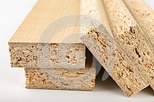 Particleboard with veneer is cut into small pieces. Materials for carpenters to build furniture