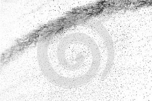 The particles of charcoal splattered on white background.