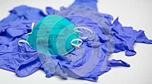 Particulate Respirator on Medical Blue Gloves photo