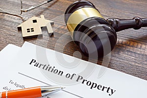 Partition of property agreement, gavel and house model.