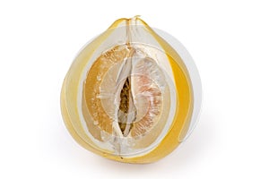 Partly cut pomelo fruit on a white background