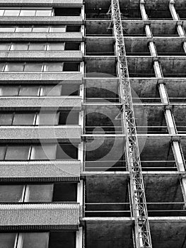 Partly demolished old concrete high rise tower block building