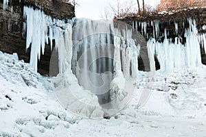 Partly frozen waterfall photo