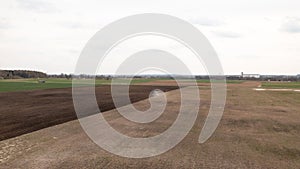 Partly Plowed Farm field in the Spring farming Season