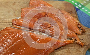 Partly sliced smoked salmon fillet skin-on