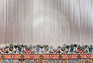 Partly woven carpet photo