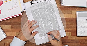 Partner checkups reports and signs contract at table