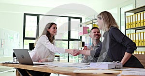 Partner manager shakes hands with employee as sign of good deal